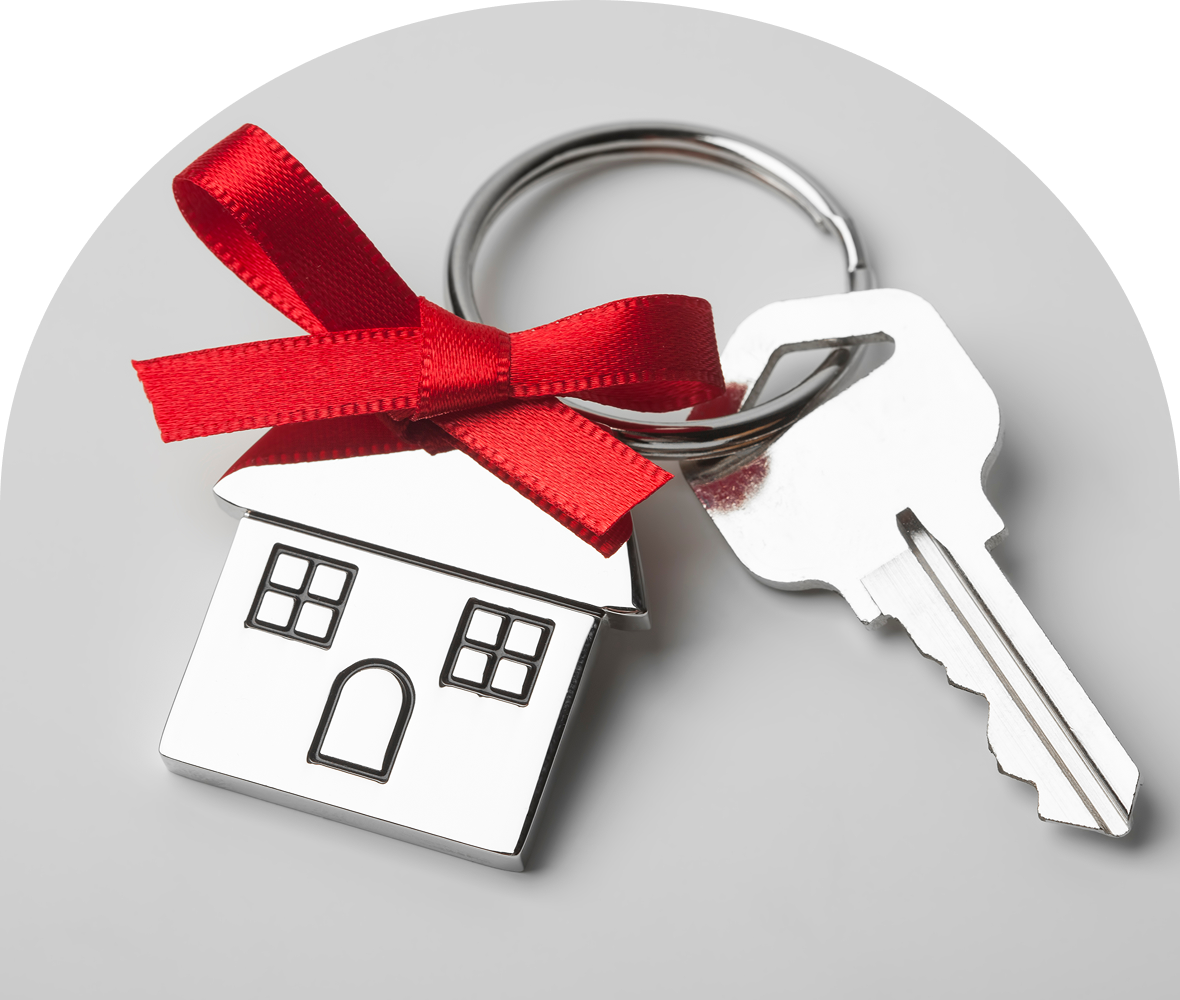 Keychain with house charm and red ribbon