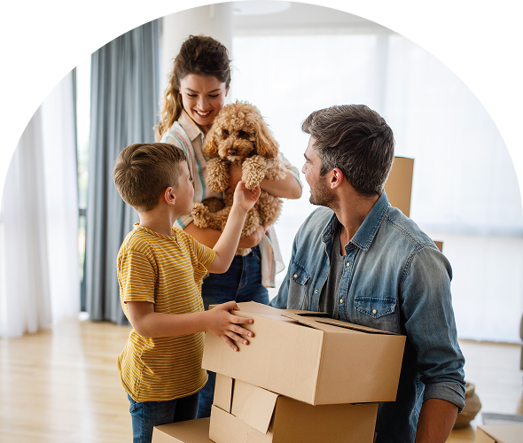 Happy family unpacking boxes together