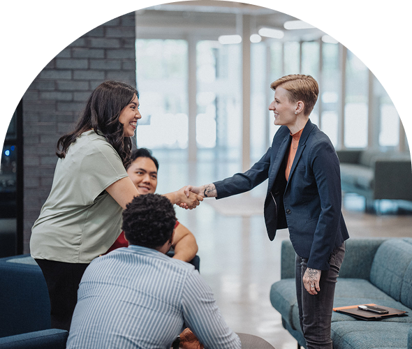 Colleagues greeting during a business meeting
